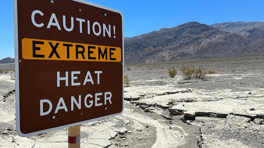 A view of sign board warning of extreme heat in Death Valley, California