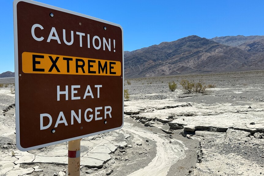 A view of sign board warning of extreme heat in Death Valley, California