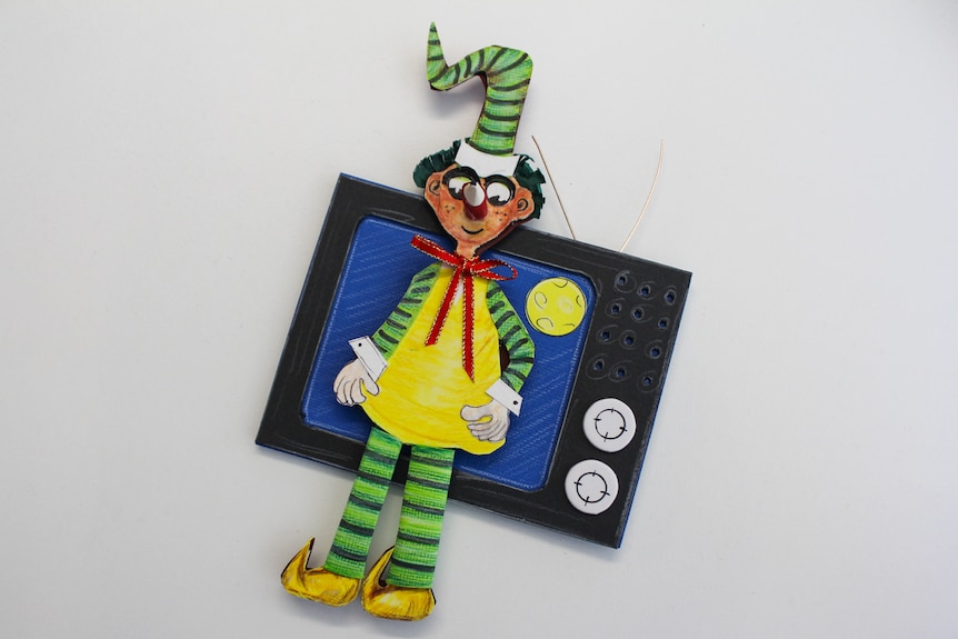 Paper character on a magnet.