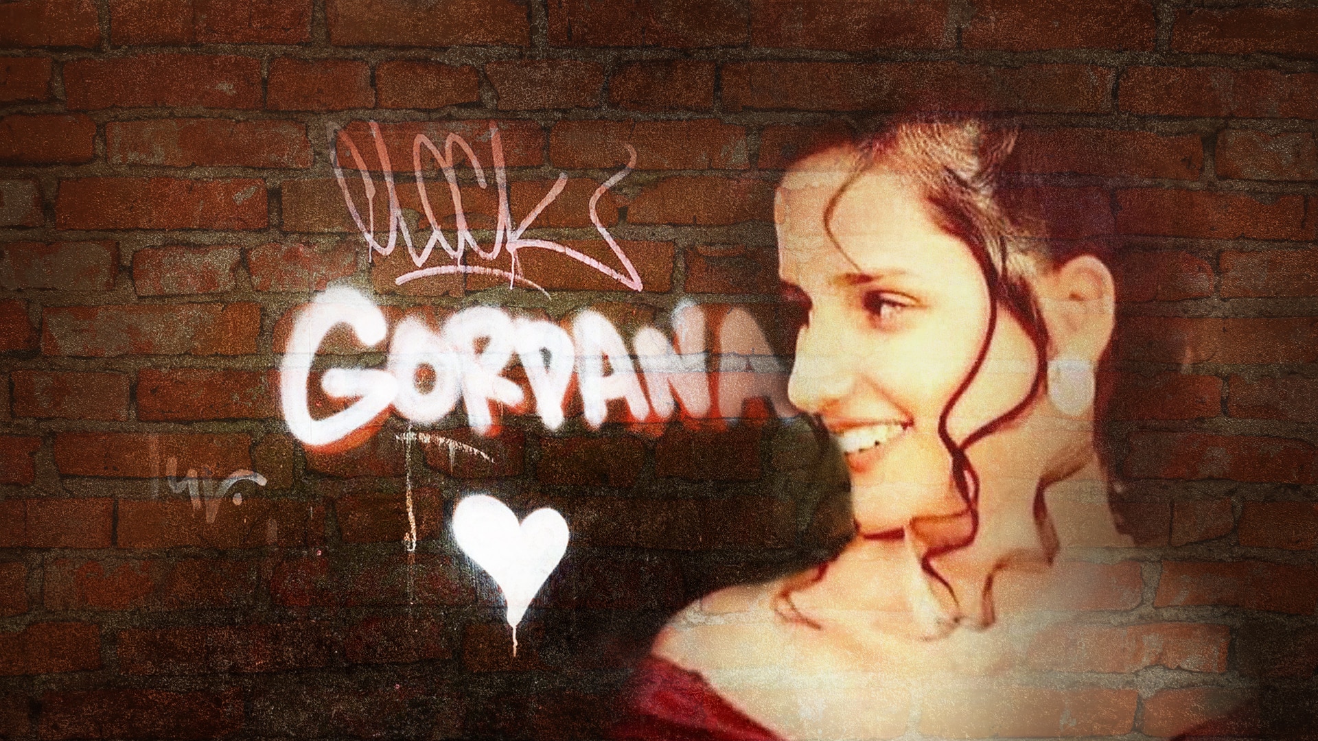A wall with Gordana spray painted on it next to a photo of Gordana with brown curly hair  