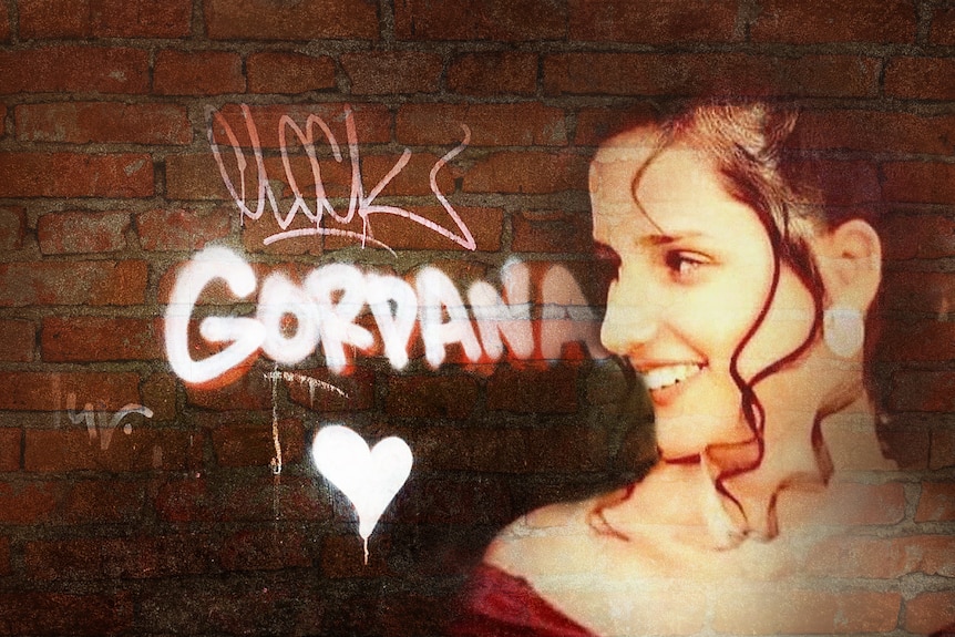 A wall with Gordana spray painted on it next to a photo of Gordana with brown curly hair  