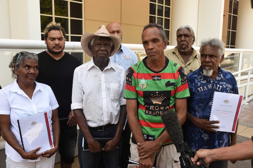 Wubalawun traditional owners of Larrimah stand together outside the Supreme Court.