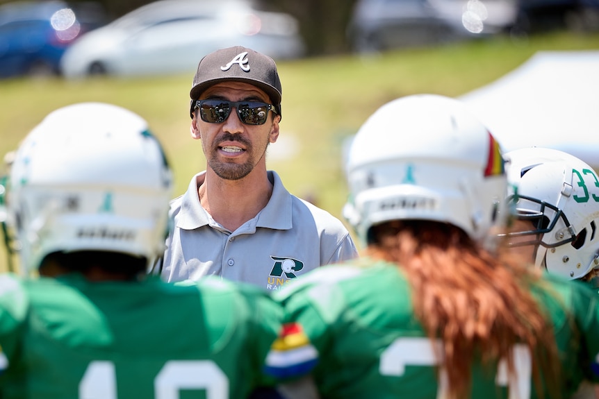 Dane Robertson speaking to his team during the break.