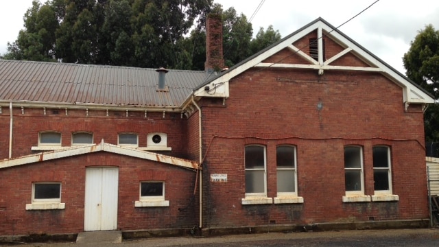 The Mount Lyell mining and railway buildings have been ravaged by time.