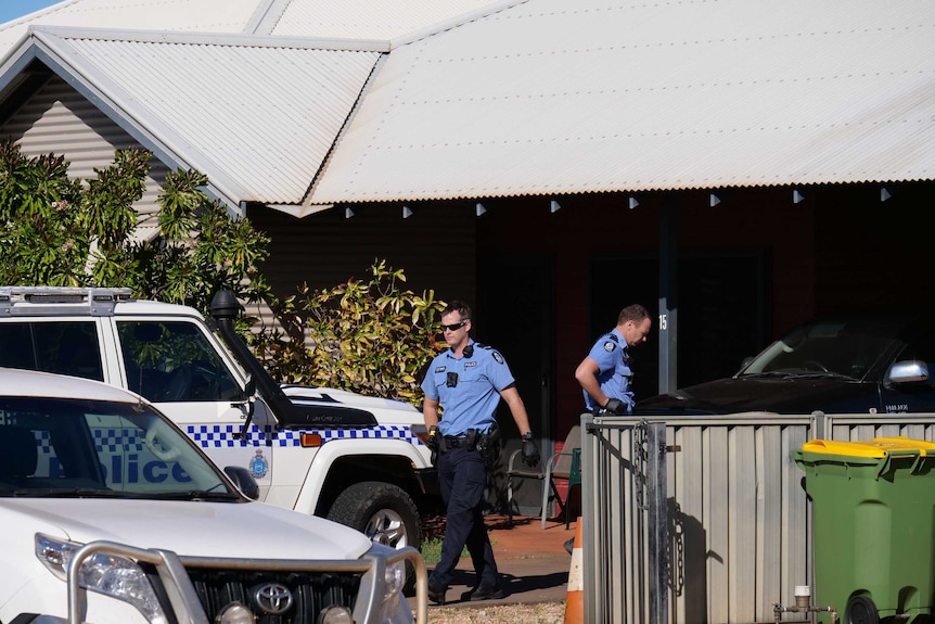 Police stand outside a home in Cable Beach