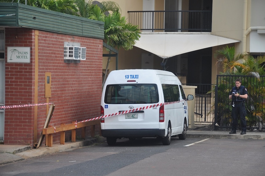 A Blue Taxi, the company which Mr Baydoun worked for, roped off outside the Palms Motel.