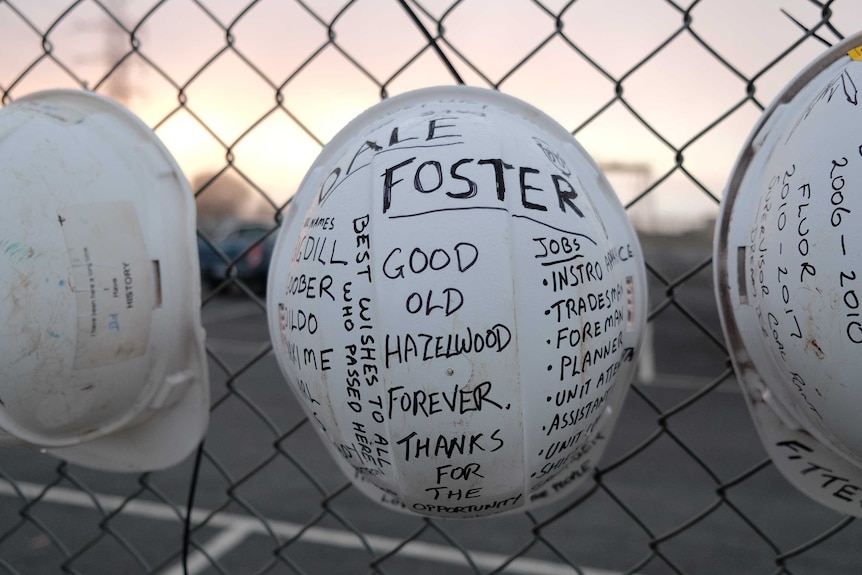 Hardhats hanging on a fence at Hazelwood power station.