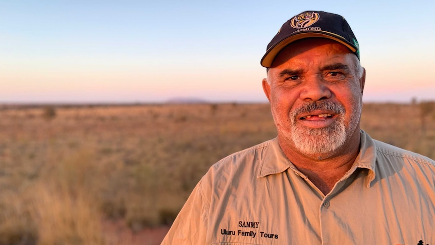 Sammy Wilson stands at his remote outstation near Uluru
