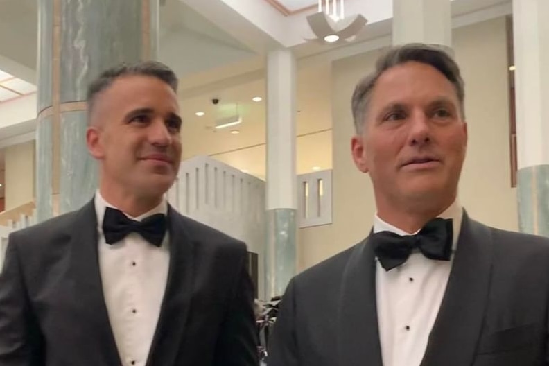 Two men in suits and bow tie