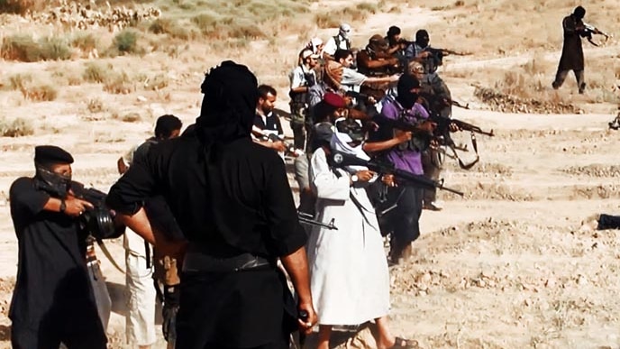 Militants of ISIS execute captured members of the Iraqi security forces.