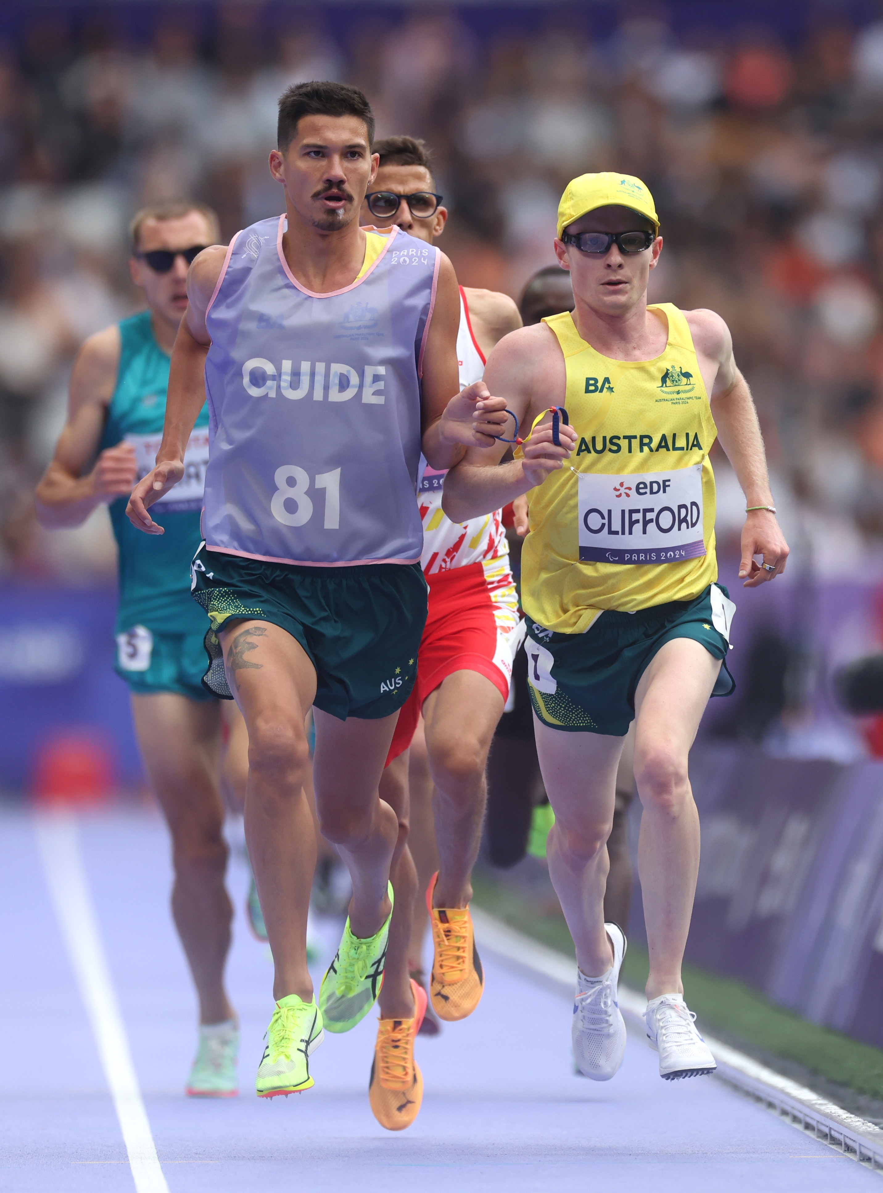 Jaryd Clifford competing with his guide at the Paris Paralympics.