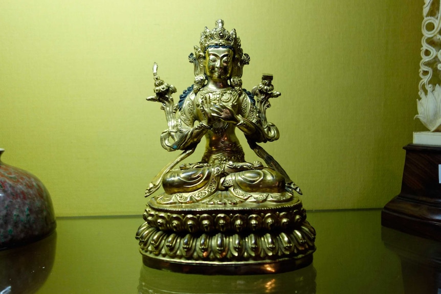 The statue of Buddha was sold for $18,000 at the auction.