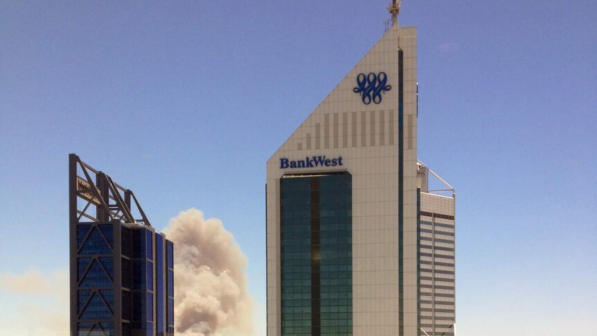 Smoke clouds can be seen from towers in Perth's CBD as a scrub fire burns in Jolimont.