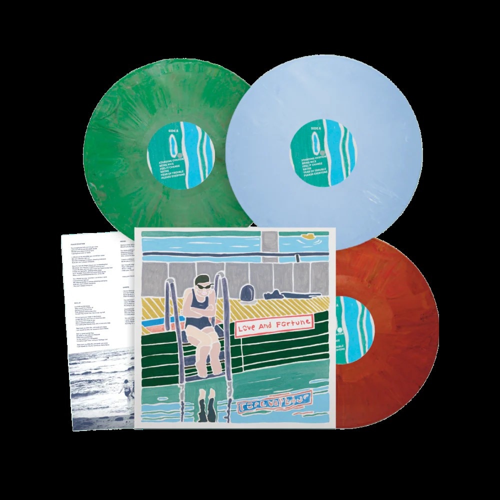 Three coloured vinyl records with album cover art and lyric sheet for “Love and Fortune.”