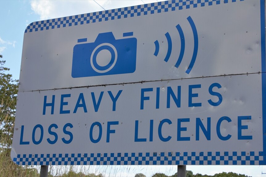 A road for a speed camera reads 'Heavy fines, Loss of licence'.