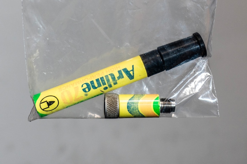 A close-up shot of a homemade marker pen gun in two pieces in a plastic ziplock bag.
