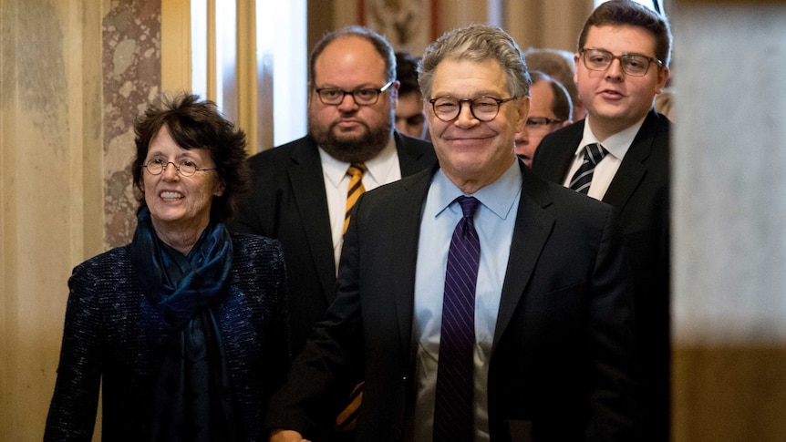 Al Franken holding hands with his wife Franni Bryson