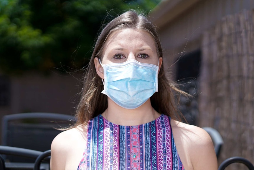 A woman wearing a face mask