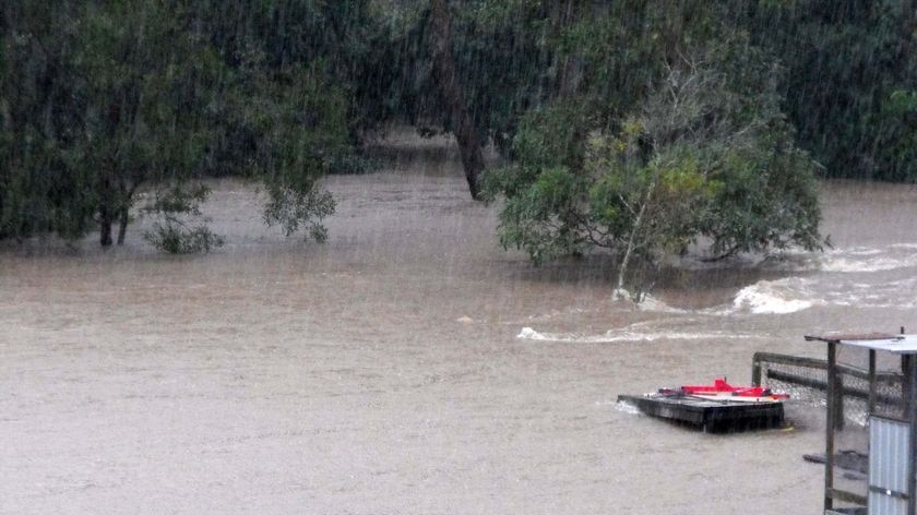 Creeks flooded ... Burpengary residents say the water has taken out fences and is rising quickly.