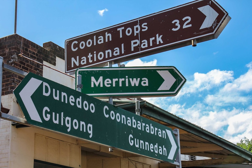 Road signs in town point to Coolah Tops National Park and directions to Merriwa, Dunedoo and Coonabarabran.