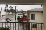 A beachside street is flooded at Seaforth in Mackay.