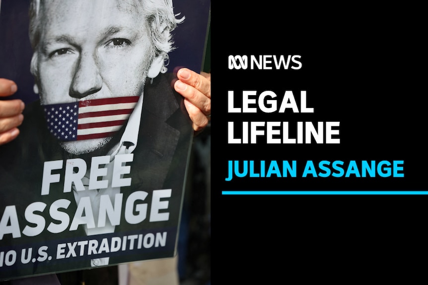 Legal Lifeline, Julian Assange: A sign calling for Julian Assange's release is held at a rally.