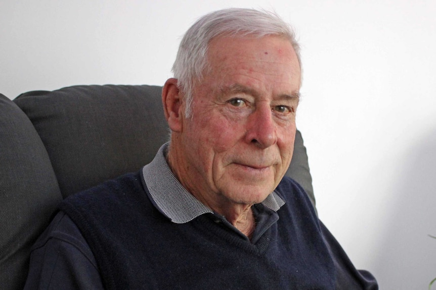 Albany Community Hospice volunteer Ian Bateman sits in a chair.