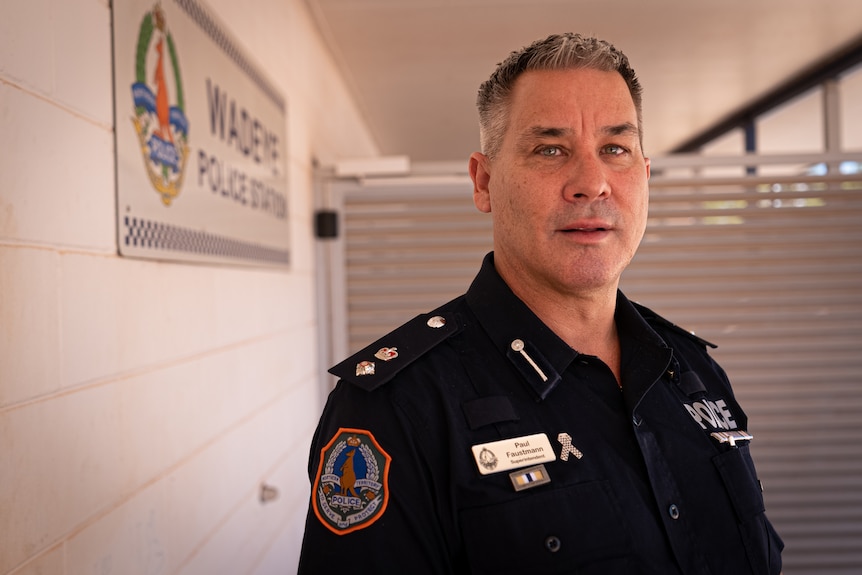 NT Police Superintendent Paul Faustmann standing against the police station wall.