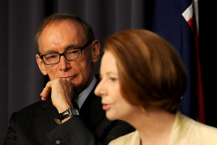 Bob Carr looks at Julia Gillard