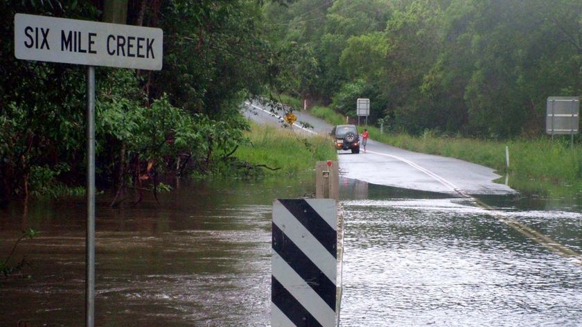 Floodwaters cover the Six Mile Creek bridge