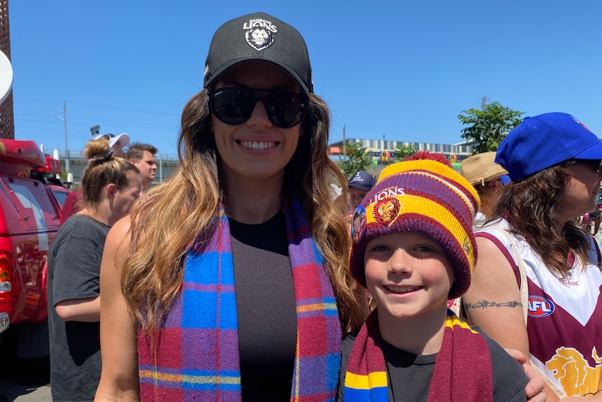 Erin and Hugo Bigg wearing Brisbane Lions merch