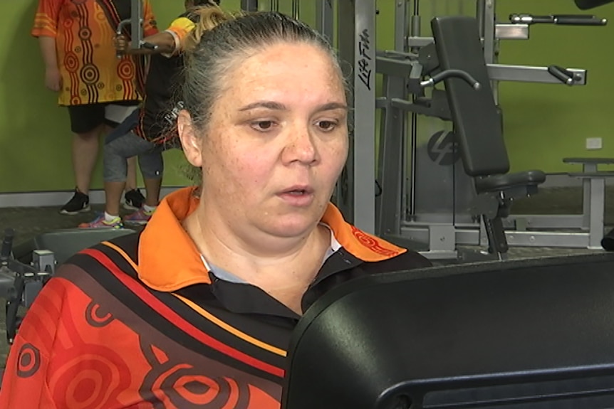 A woman exercising in the gym.