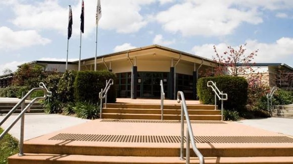 Two people have been charged over a bomb threat made to the Calamvale Community College.