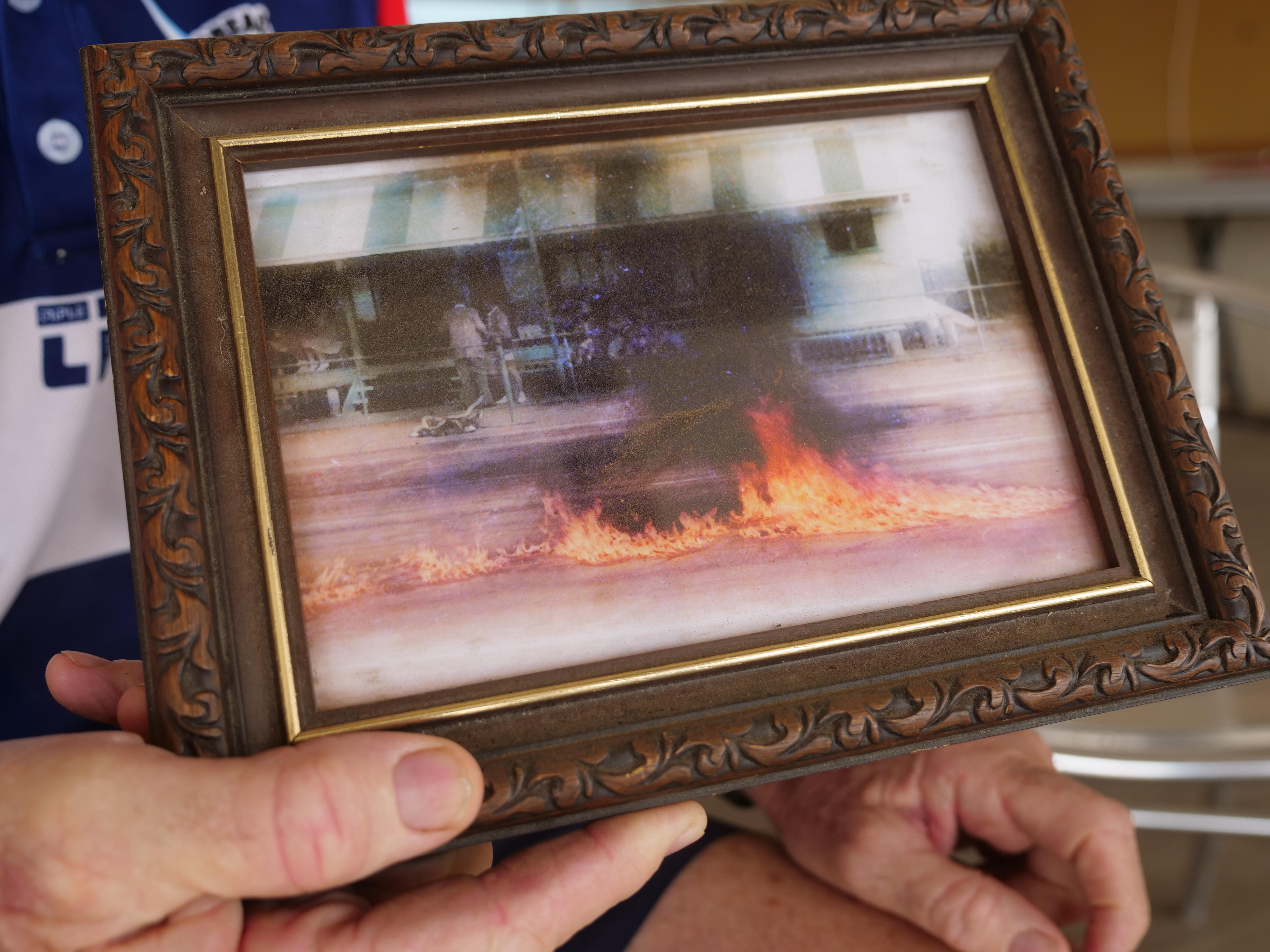 Framed photo of a tennis court on fire