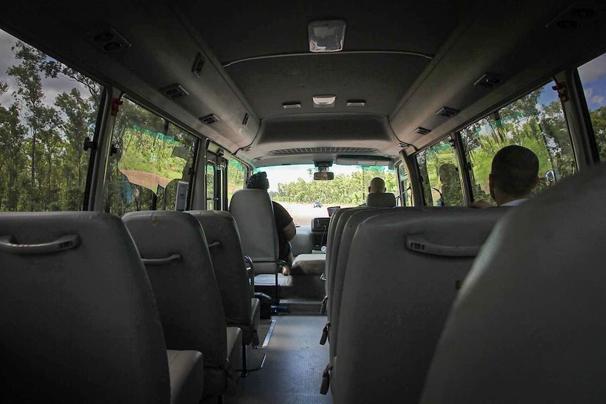 A photo the interior of the shuttle bus to prison.