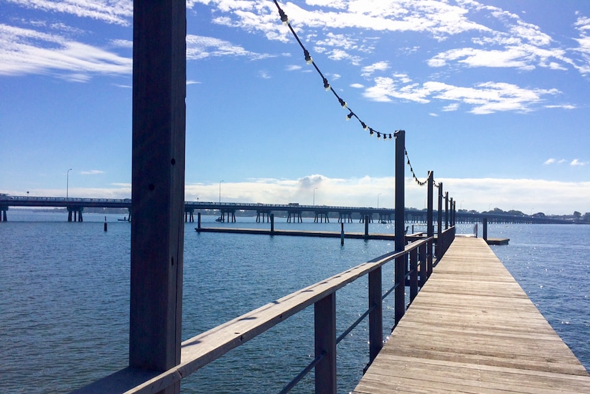 The wooden walkway leading down to the new pontoon made from the former Brisbane Riverwalk.