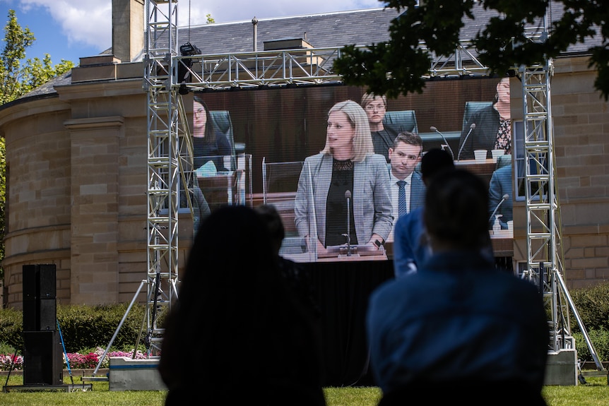 Members of the public listen to Labor's Rebecca White at the Tasmanian parliamentary apology to child sexual abuse survivors.