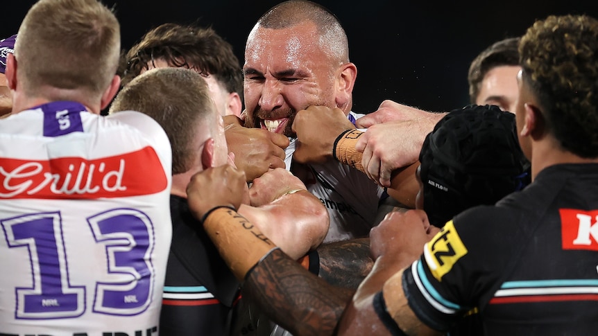 Two rugby league players face off during a match