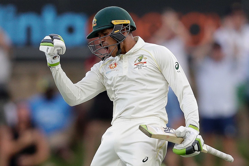 Usman Khawaja pumps his fist in celebration