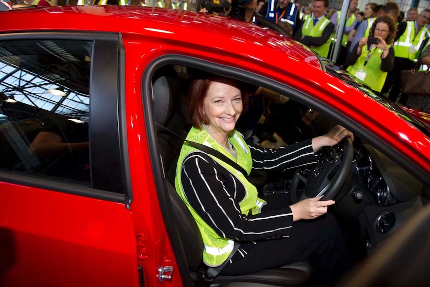 Julia Gillard sits in the driving seat of a Holden