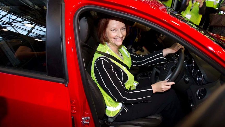 Julia Gillard sits in the driving seat of a Holden
