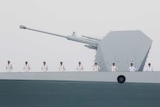 Men line up along a Chinese destroyer