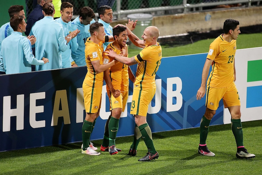 Australia's Massimo Luongo (2R) celebrates after scoring against Iraq in World Cup qualifier.