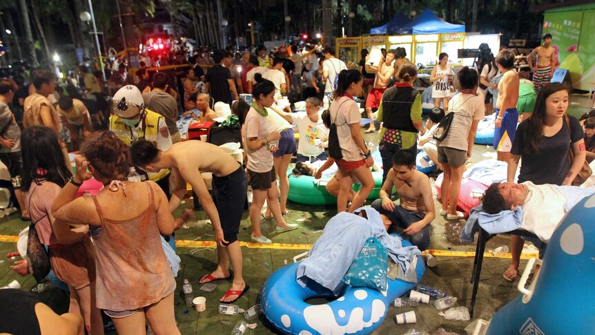 Rescue workers tend to injured people at an amusement park in Taiwan after an explosion