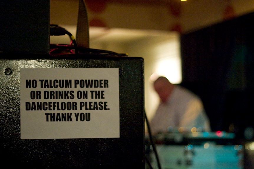 A sign reads 'no talcum powder on the dance floor'