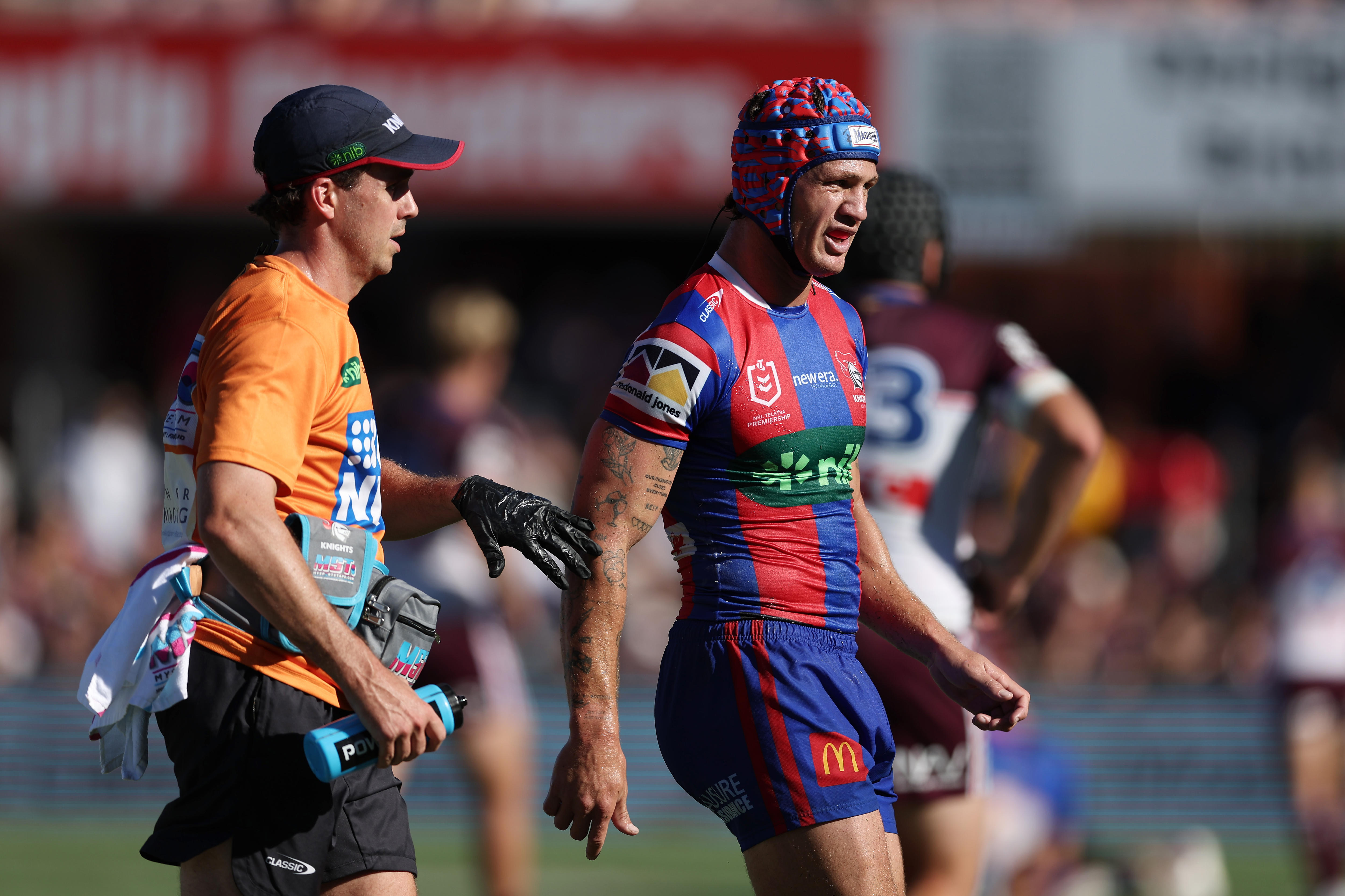 Kalyn Ponga walks off with a Newcastle Knights trainer.
