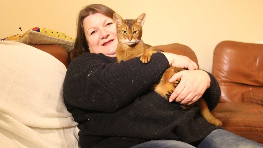 Tracey Phillips holds her cat