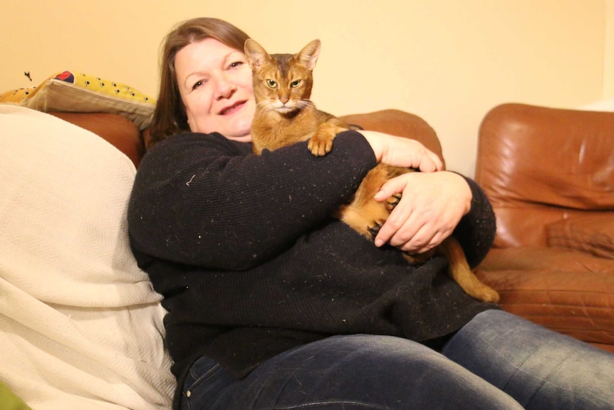 Tracey Phillips holds her cat