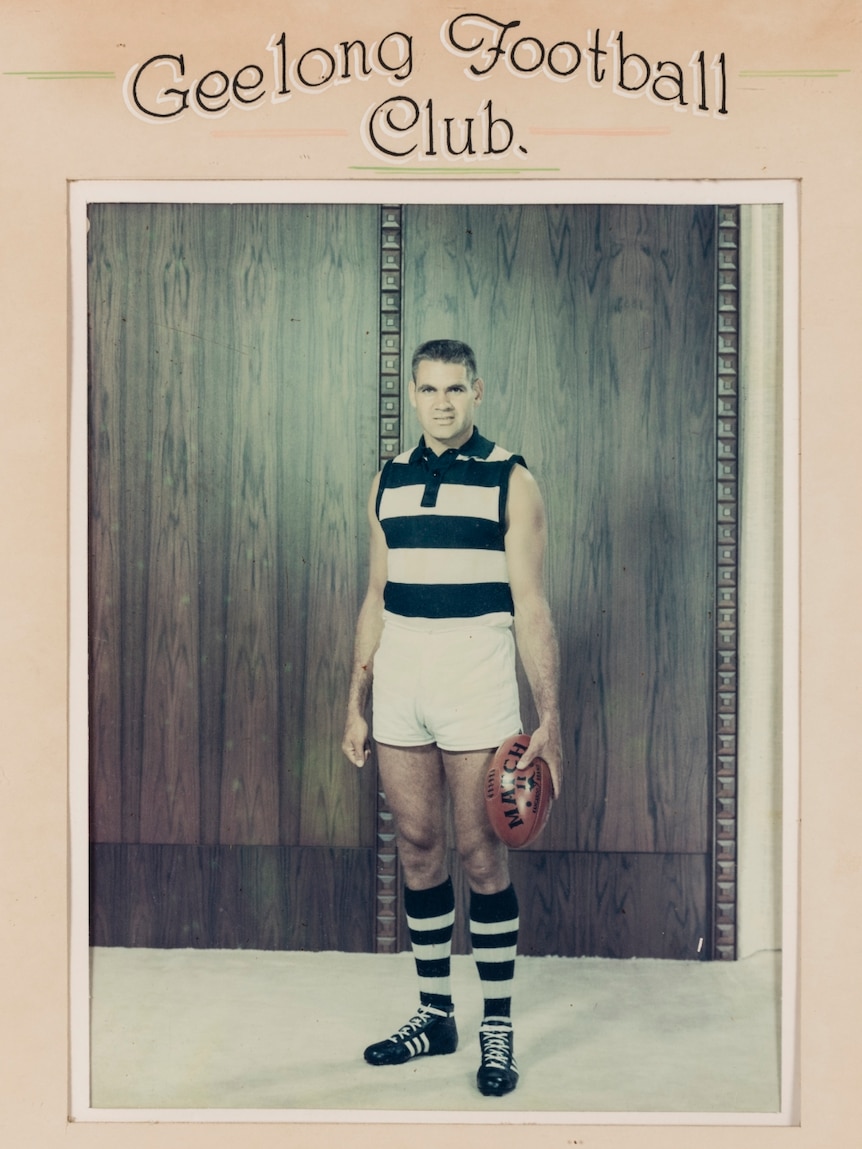 A framed photograph of Graham 'Polly' Farmer standing with a ball in his hand.