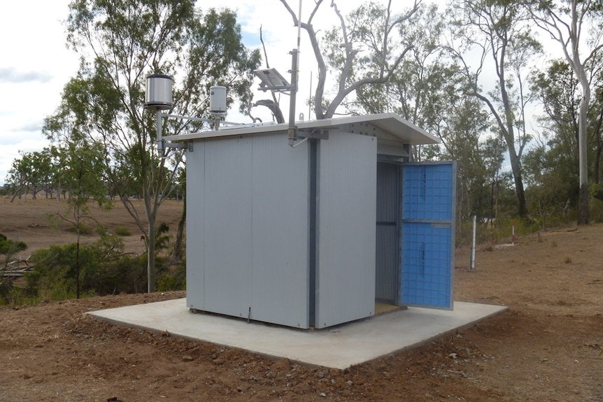 A small shed in the bush that receives water level data.